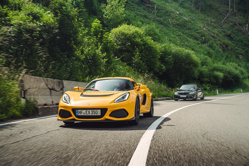 Yellow Lotus Exige on a mountain road in the Dolomites