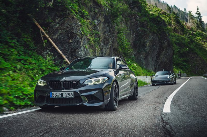 Black BMW M2 on a mountain road