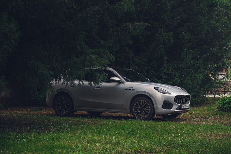 Silver Maserati Grecale at the edge of a forest