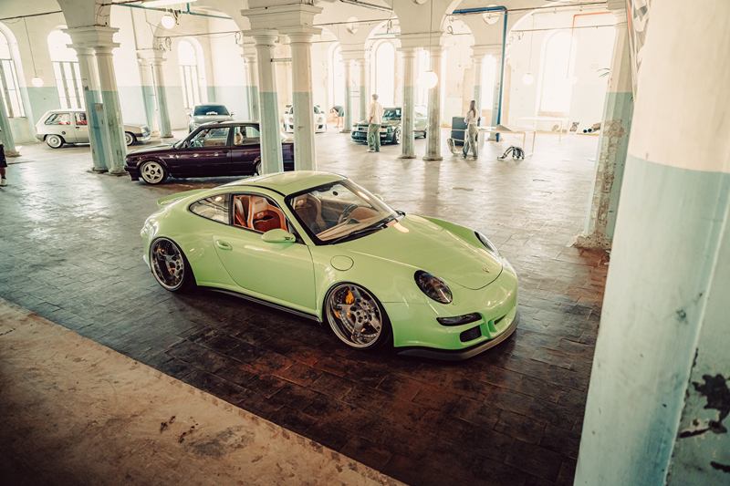 Mint green Porsche 911 in an old industrial hall
