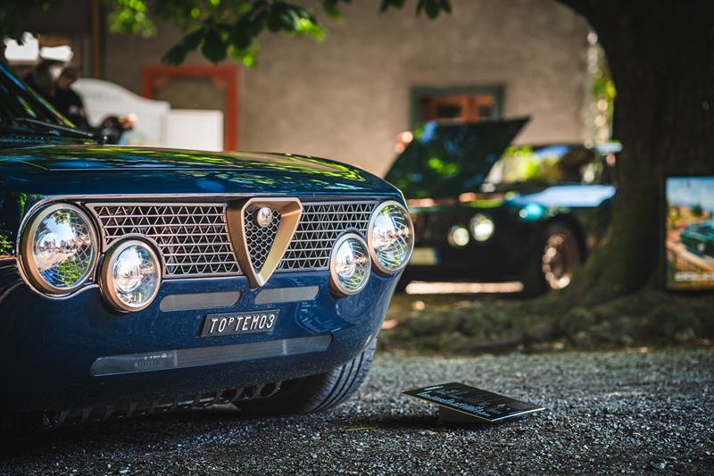 Classic blue Alfa Romeo at a car meet