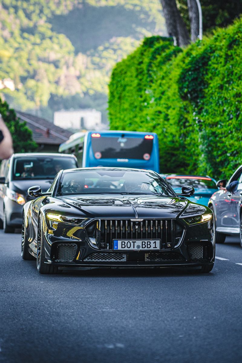 Black performance sedan on a city street