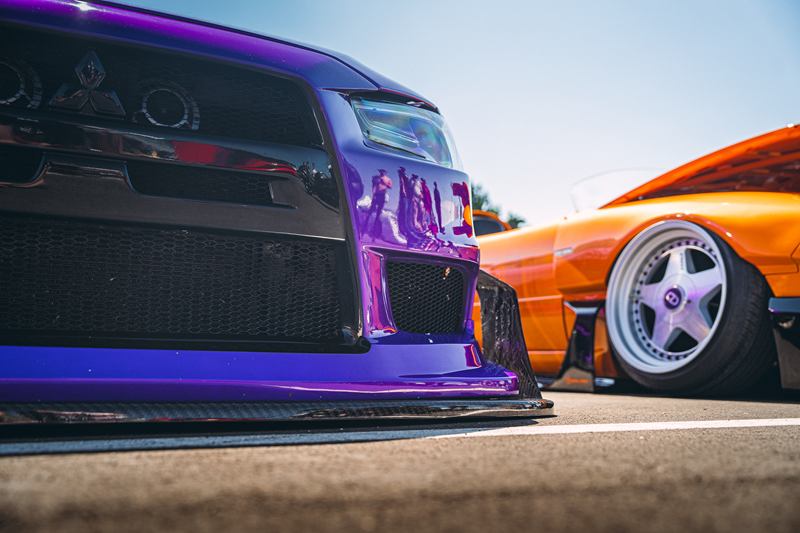 Low-angle view of a purple Mitsubishi Lancer Evolution